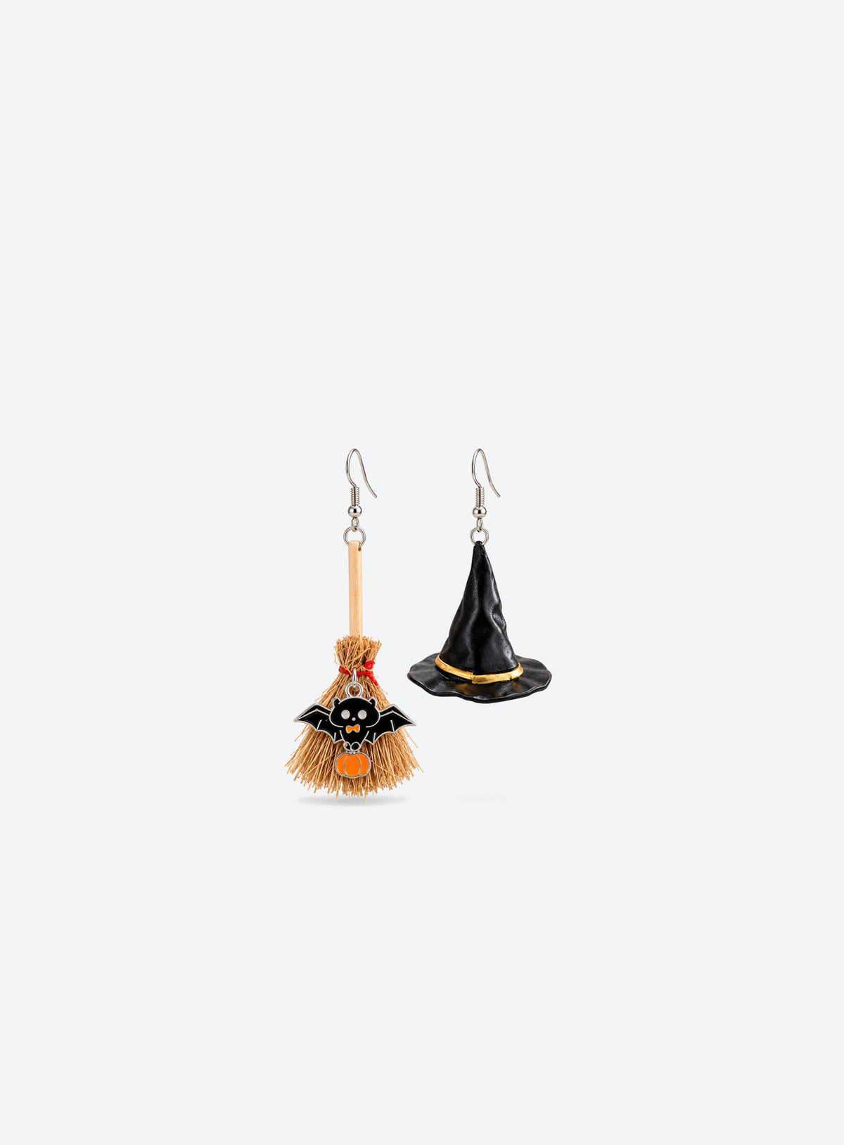 Asymmetric witch hat and broom earrings with bat and pumpkin details on silver-tone hooks