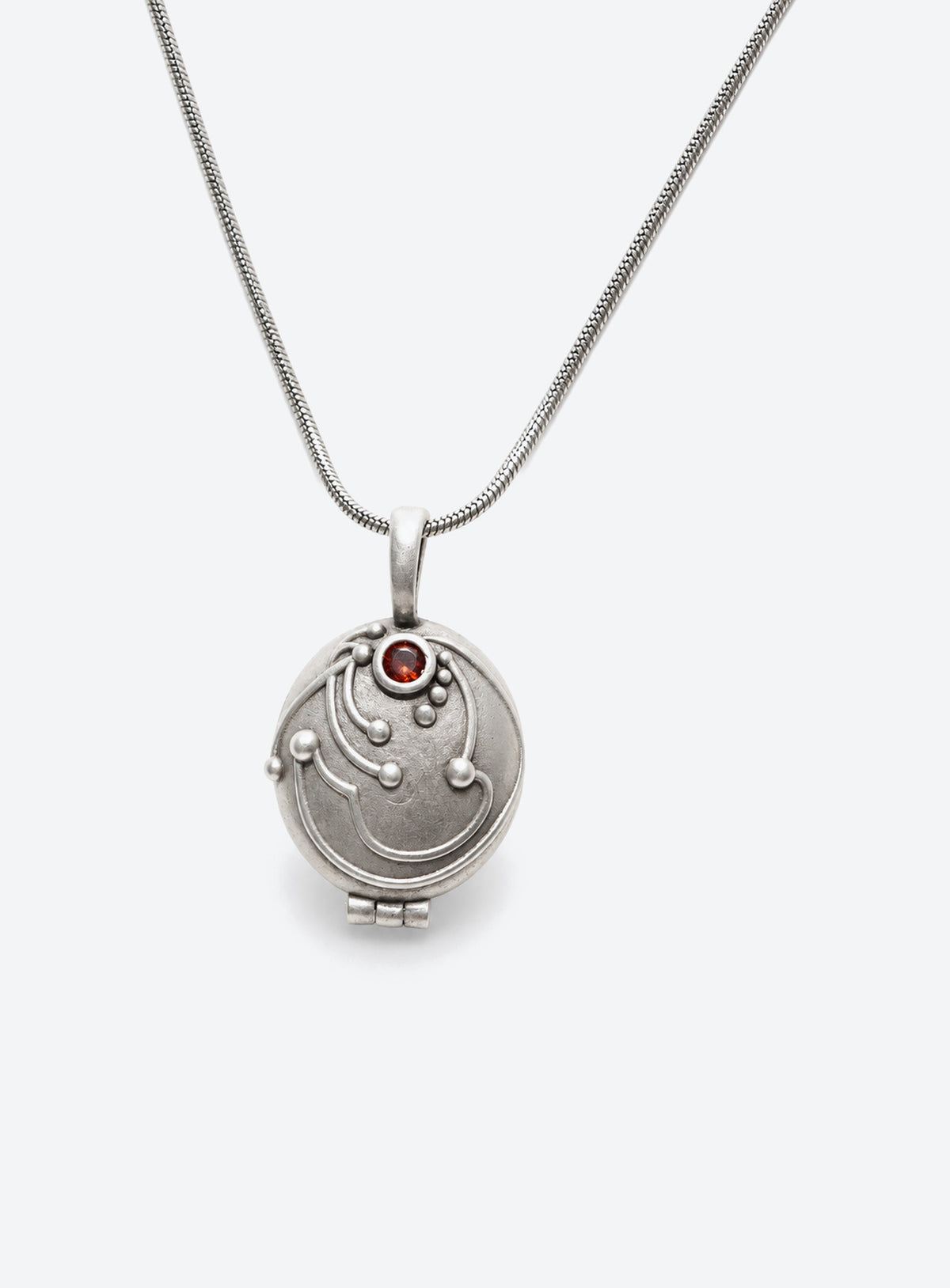 Gothic locket pendant with a red stone on a chain