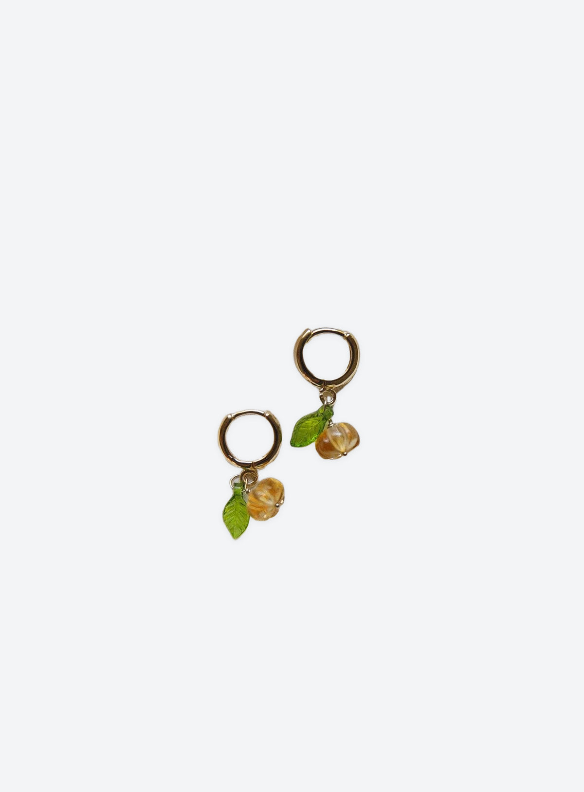 Pumpkin hoop earrings with citrine detail and gold-filled hoops on a clean studio background