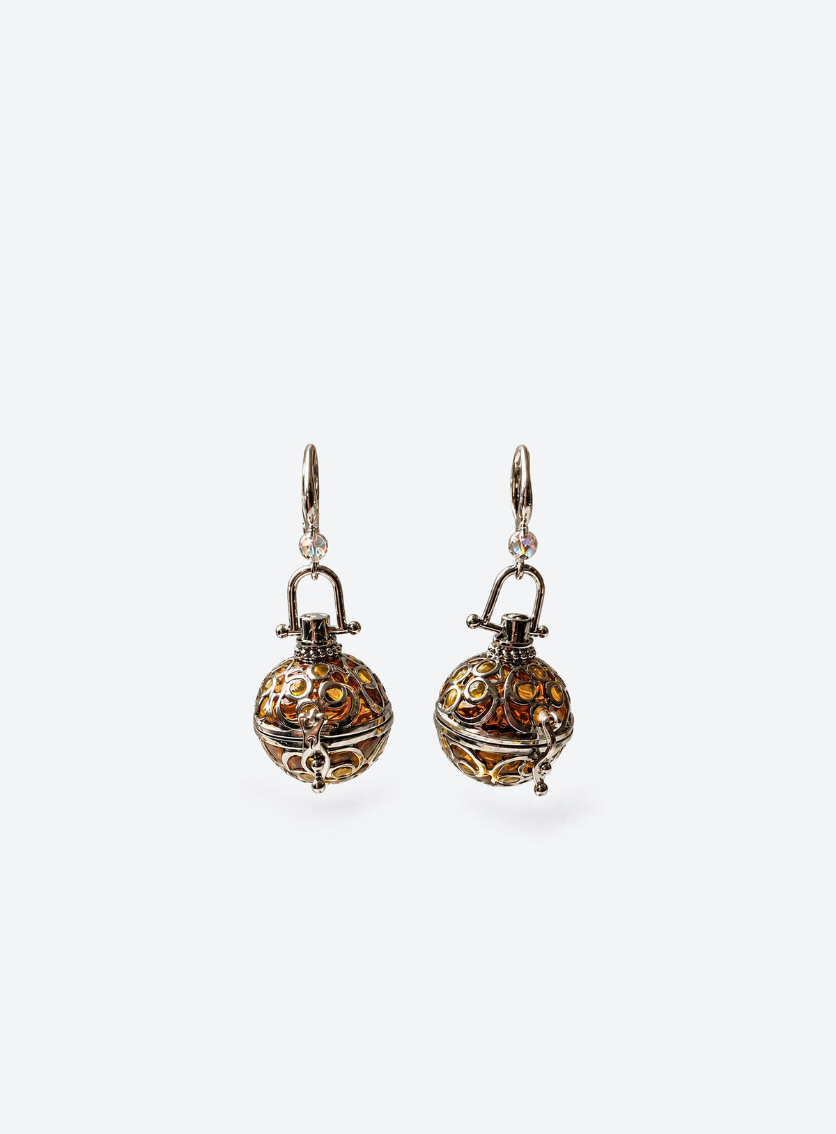 Pair of amber resin lantern earrings with silver-tone filigree cages and clear beads