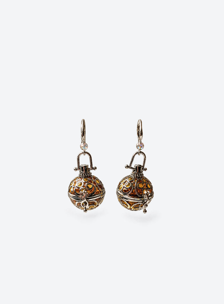 Pair of amber resin lantern earrings with silver-tone filigree cages and clear beads