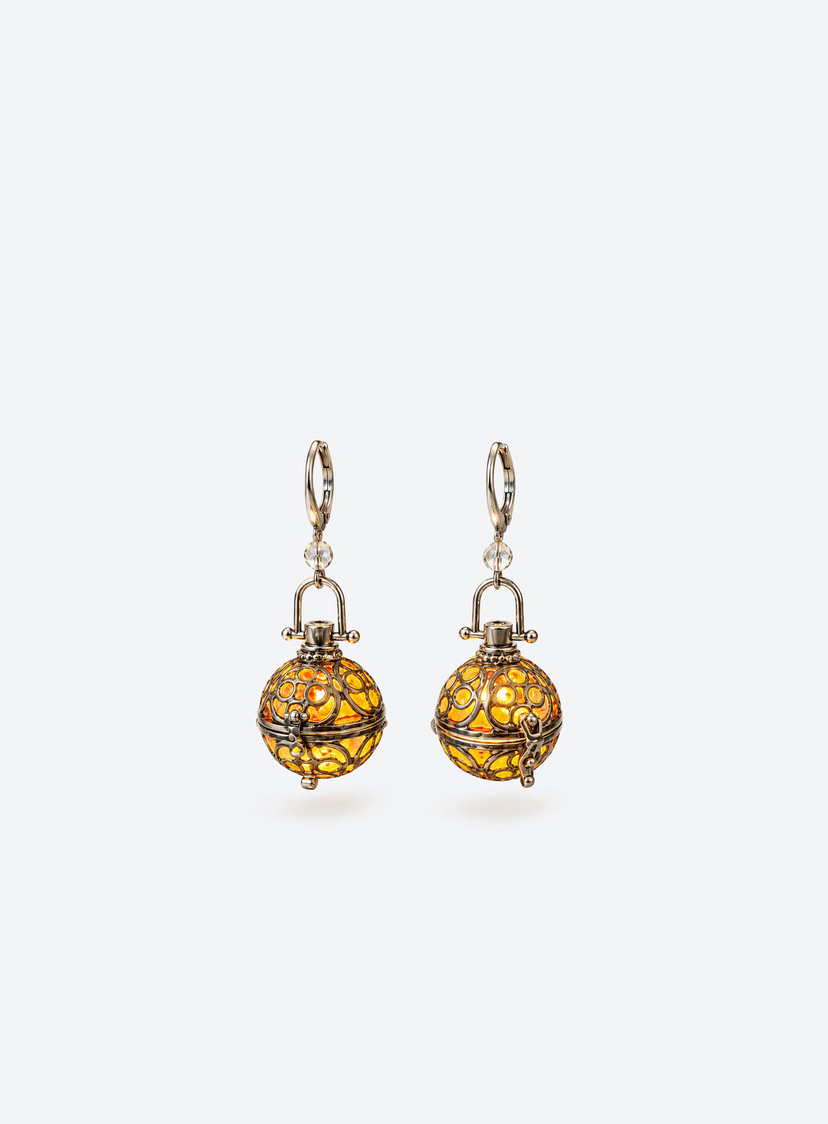 Pair of amber resin lantern earrings with silver-tone filigree cages and clear beads