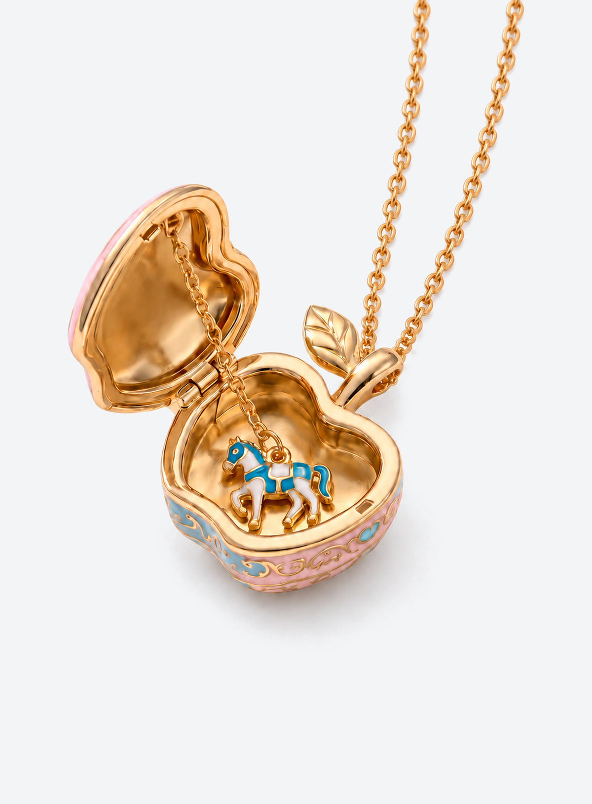 Apple-shaped locket necklace with a colored decorative front and gold-tone chain (Blue Carousel)
