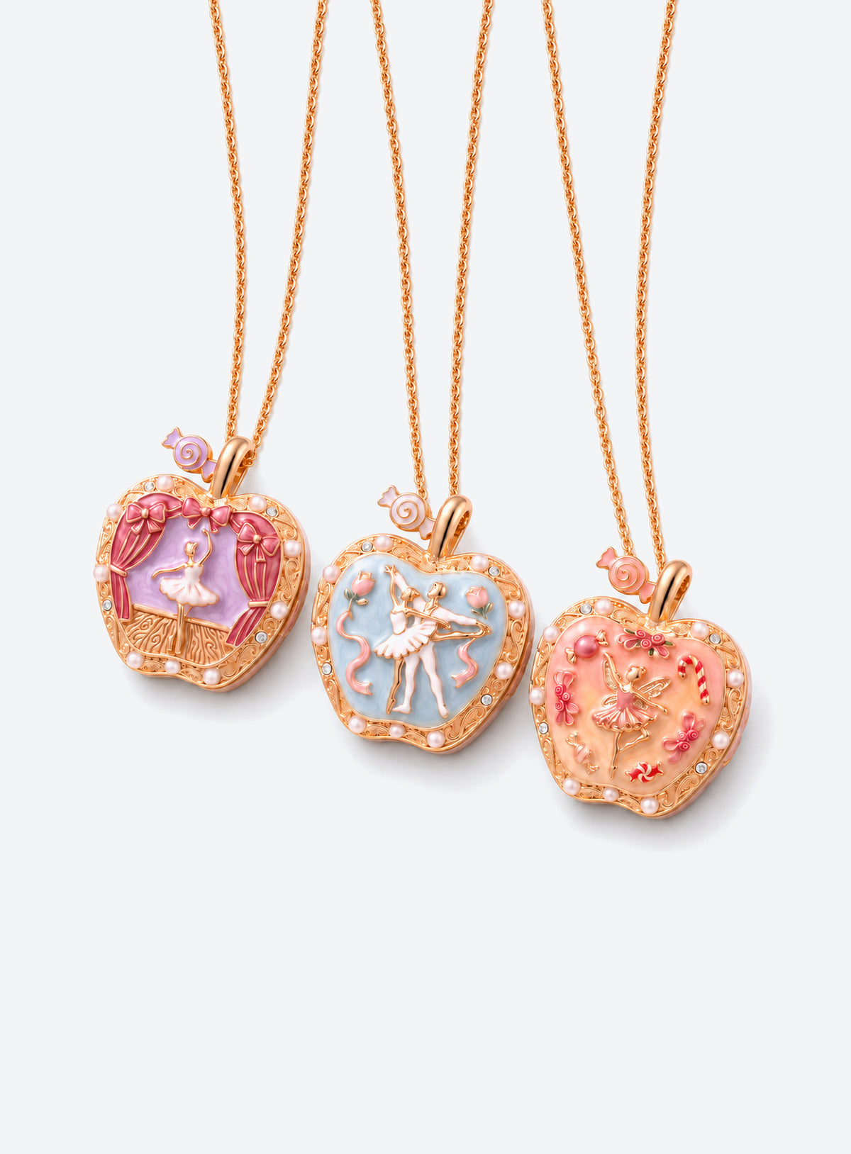 Apple-shaped locket necklace with a colored decorative front and gold-tone chain