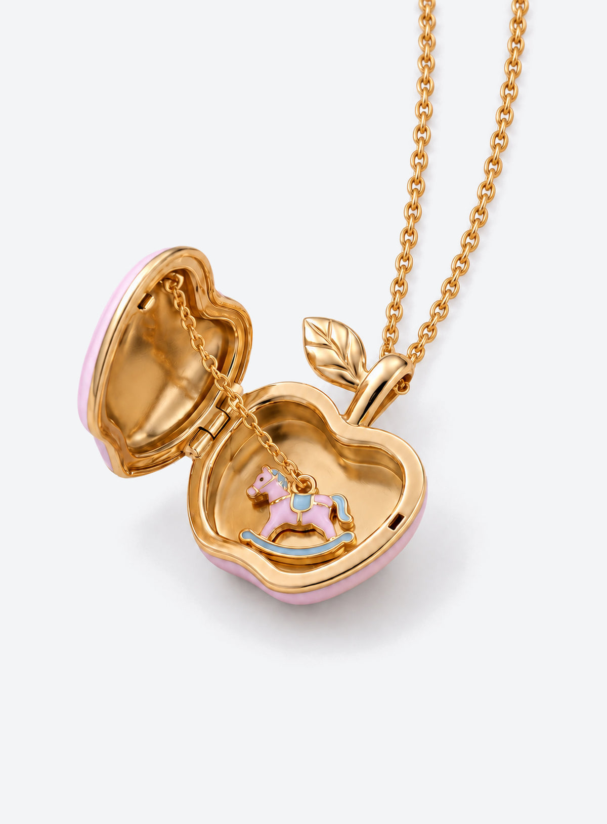 Apple-shaped locket necklace with a colored decorative front and gold-tone chain (Pink Carousel)