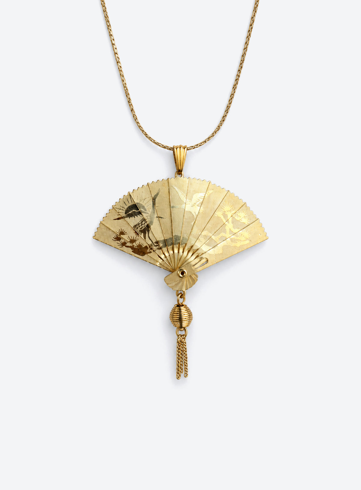 Gold-tone articulated fan pendant necklace with a crane design and matching chain