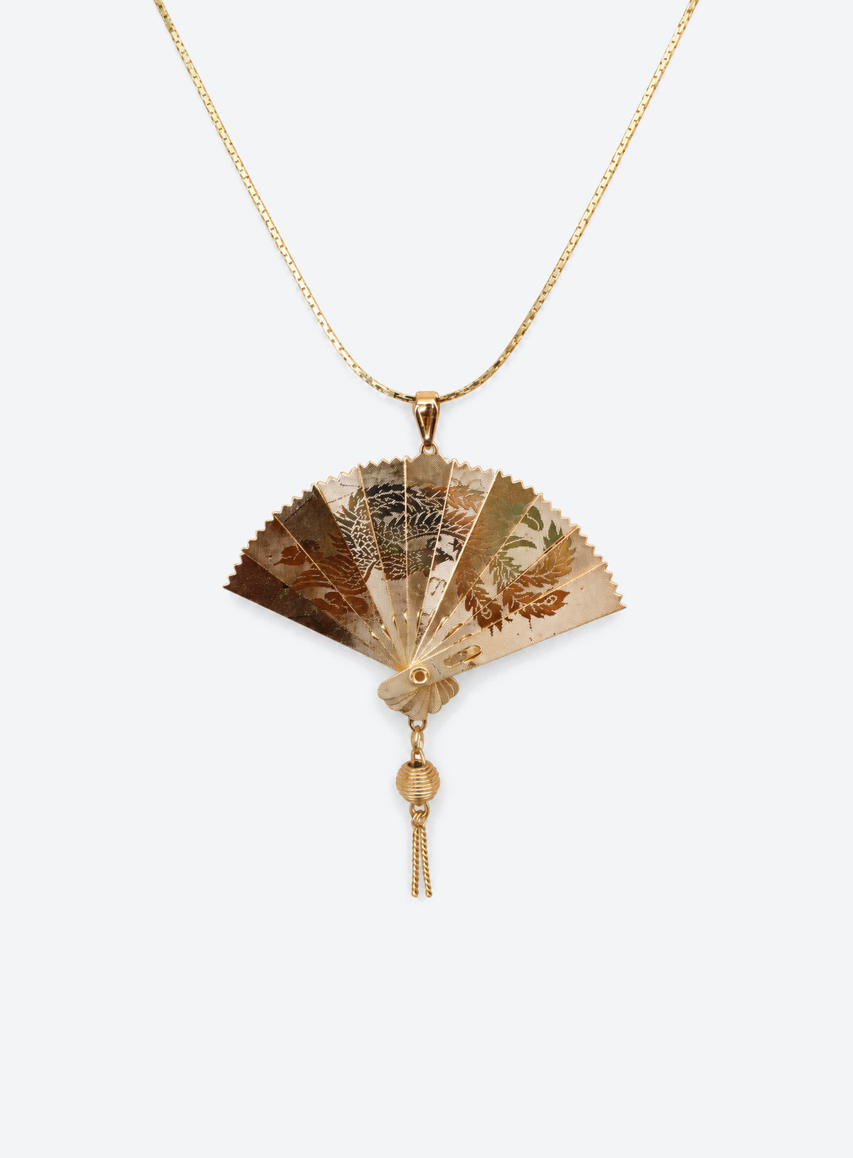Gold-tone articulated fan pendant necklace with a crane design and matching chain