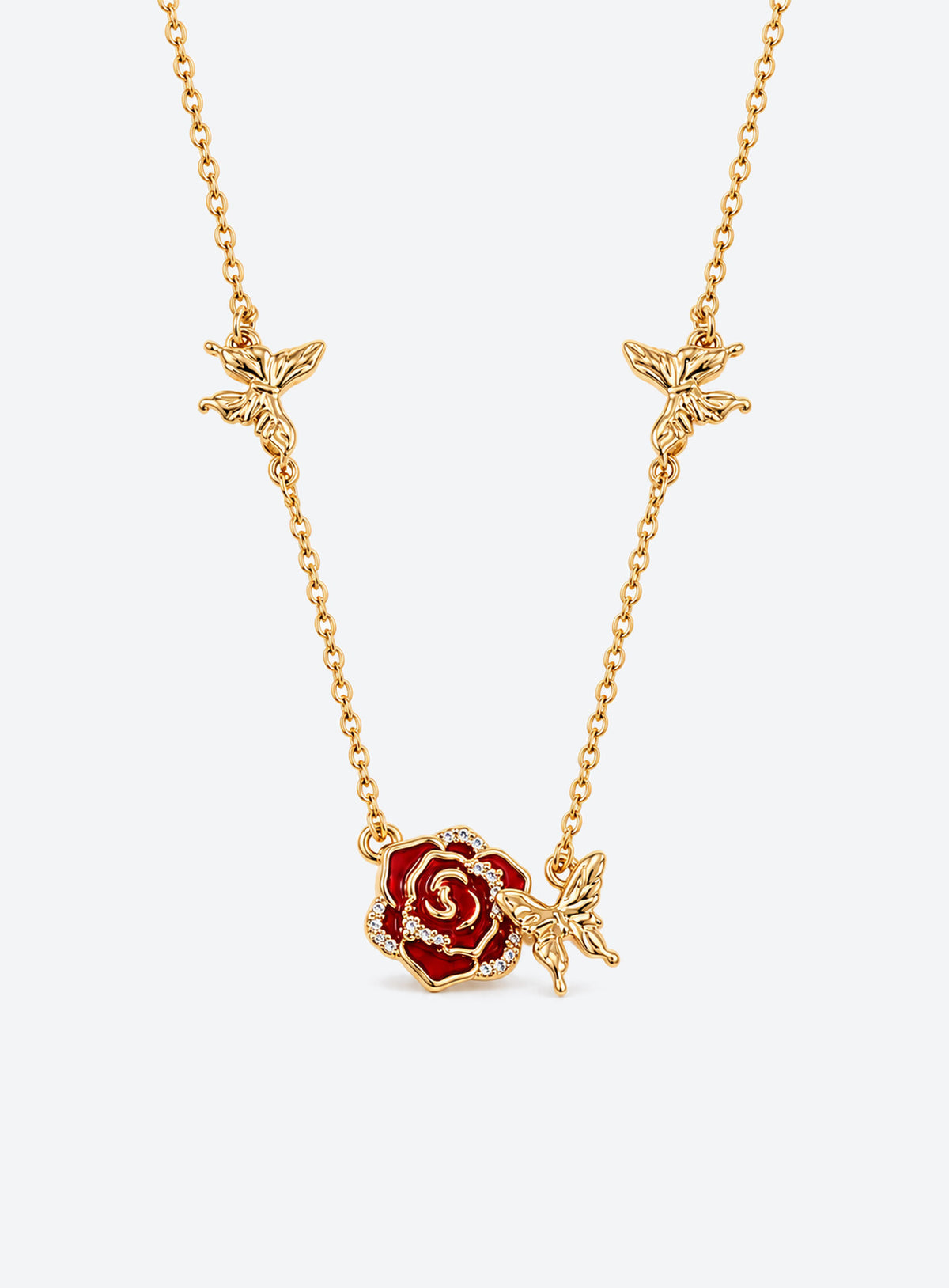 Birth flower necklace with an enamel flower centerpiece and small butterfly accents along the chain (June)