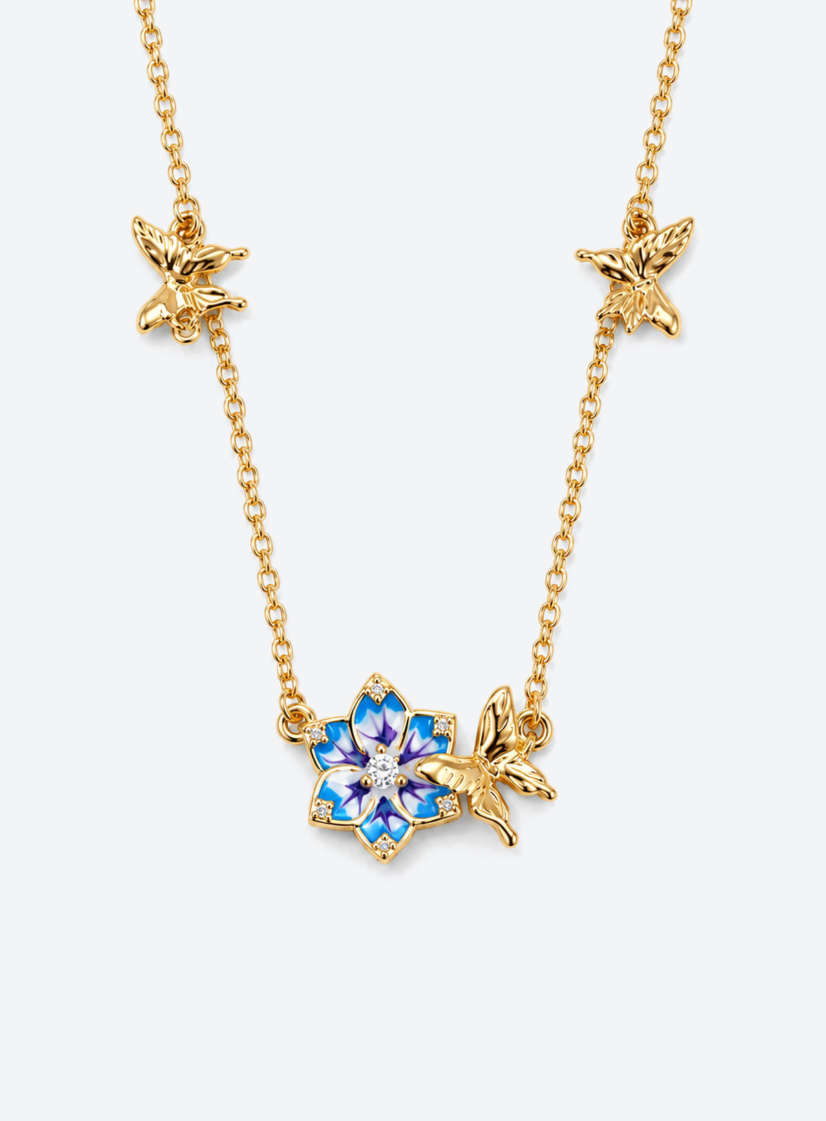 Birth flower necklace with an enamel flower centerpiece and small butterfly accents along the chain (July)