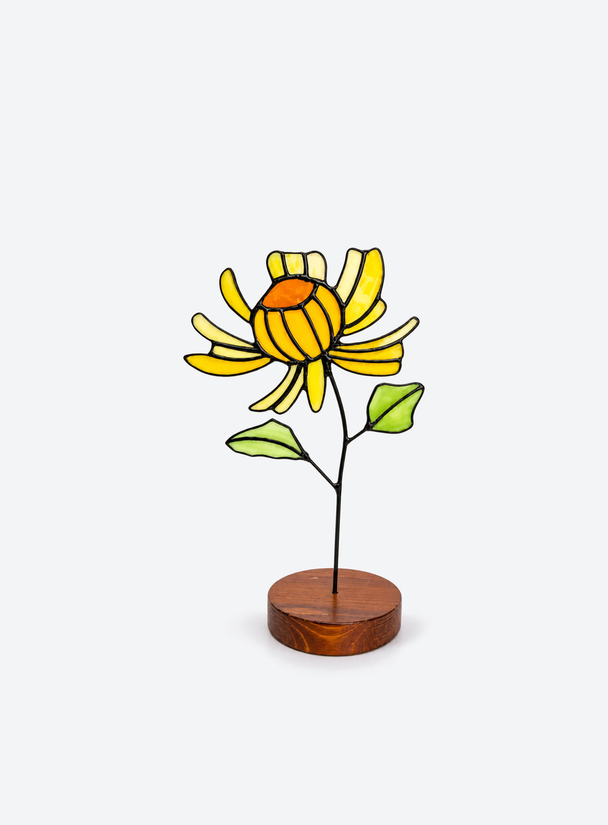 Freestanding colored-glass birth month flower with a round display base, photographed on a studio background. (November)