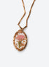 Birth month pressed-flower pendant necklace with a gold paperclip chain (January)