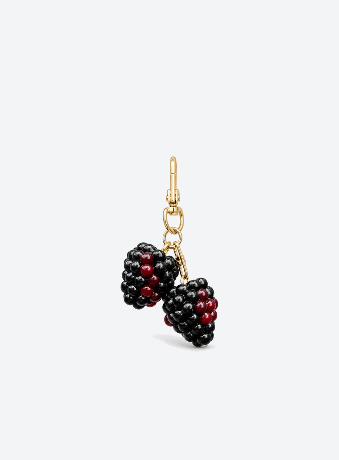 Blackberry bag charm with clustered black and burgundy details and gold-toned hardware