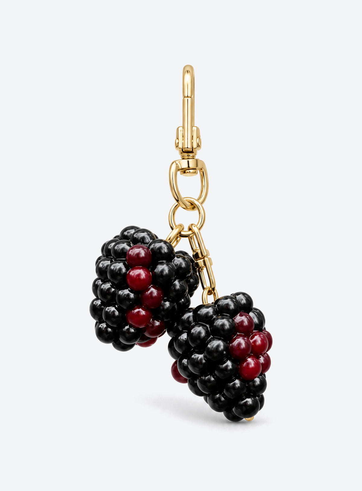 Blackberry bag charm with clustered black and burgundy details and gold-toned hardware