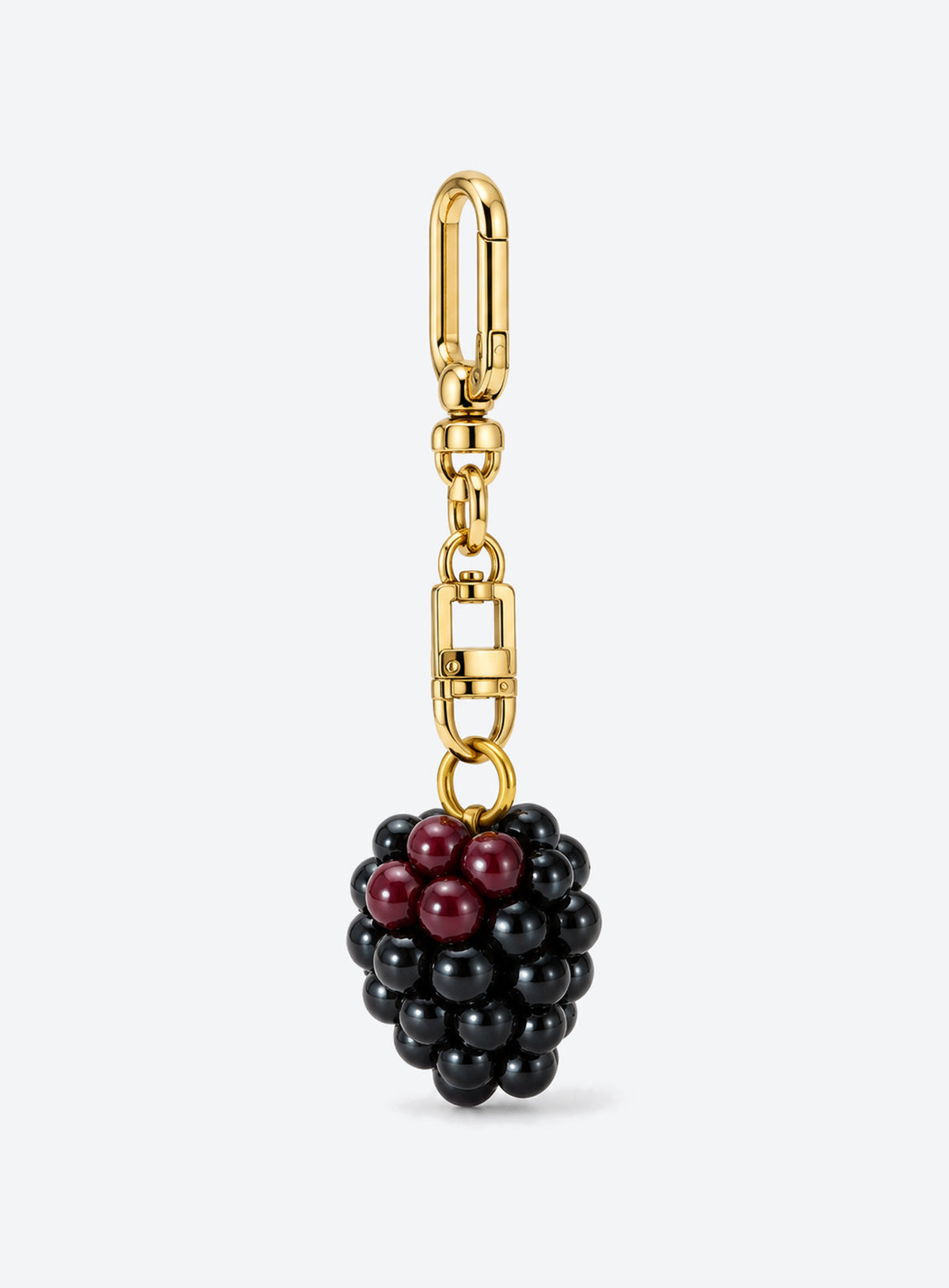 Blackberry bag charm with clustered black and burgundy details and gold-toned hardware