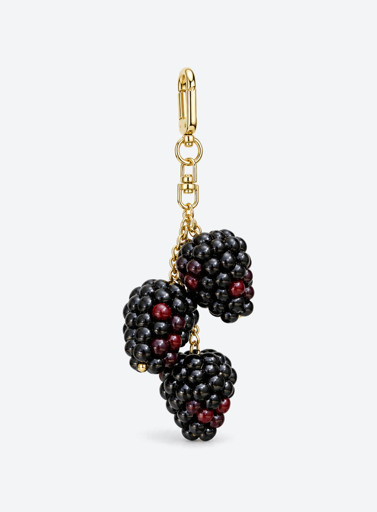 Blackberry bag charm with clustered black and burgundy details and gold-toned hardware