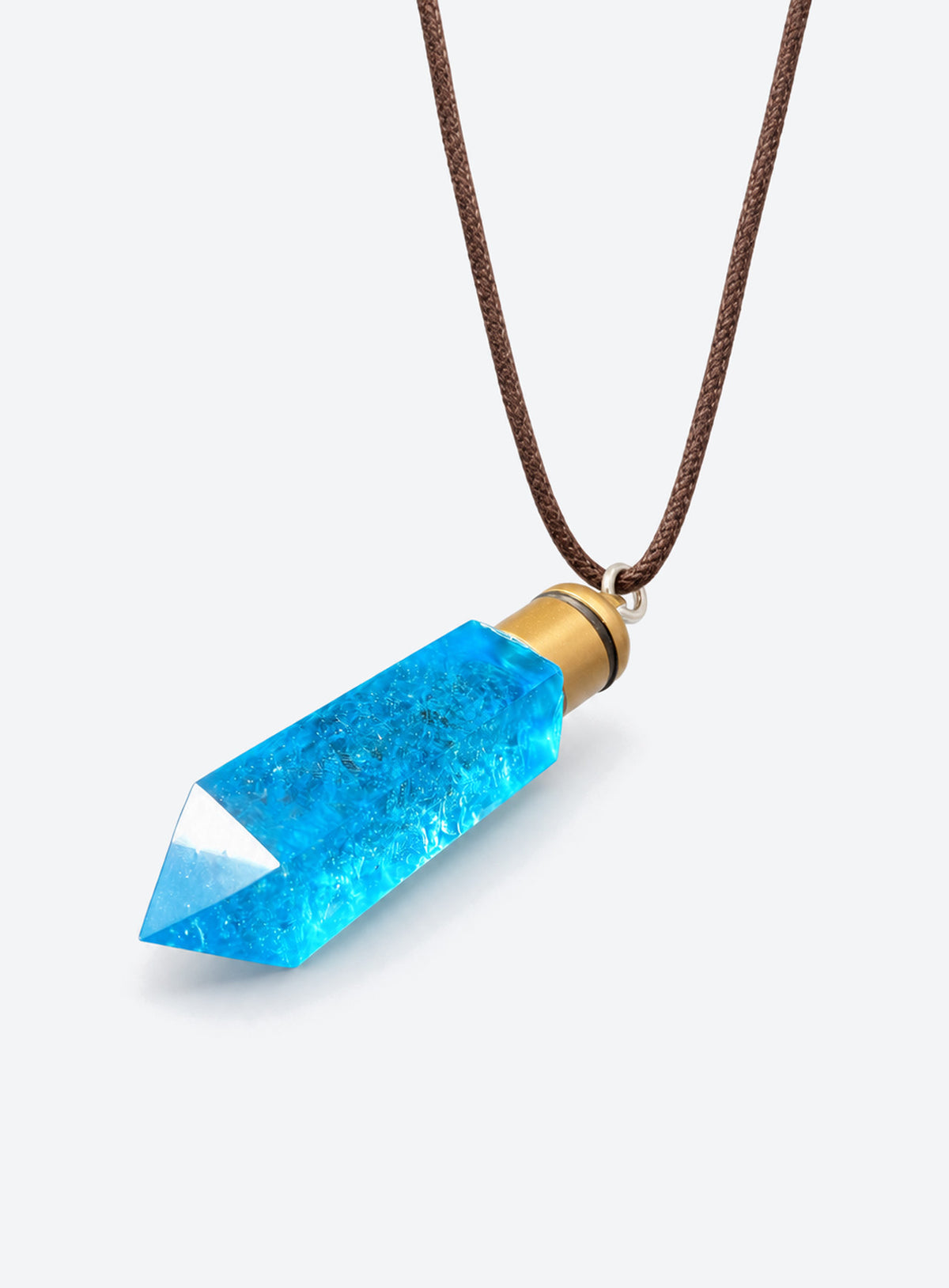 Blue faceted pendant necklace with a gold-tone cap and dark rope cord with a tie closure