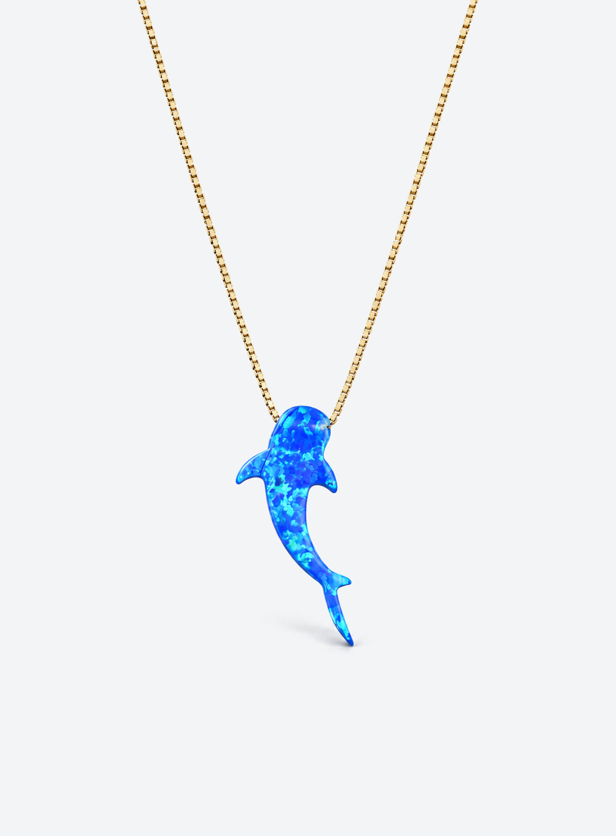 Blue synthetic-opal whale shark pendant on a gold-tone box chain