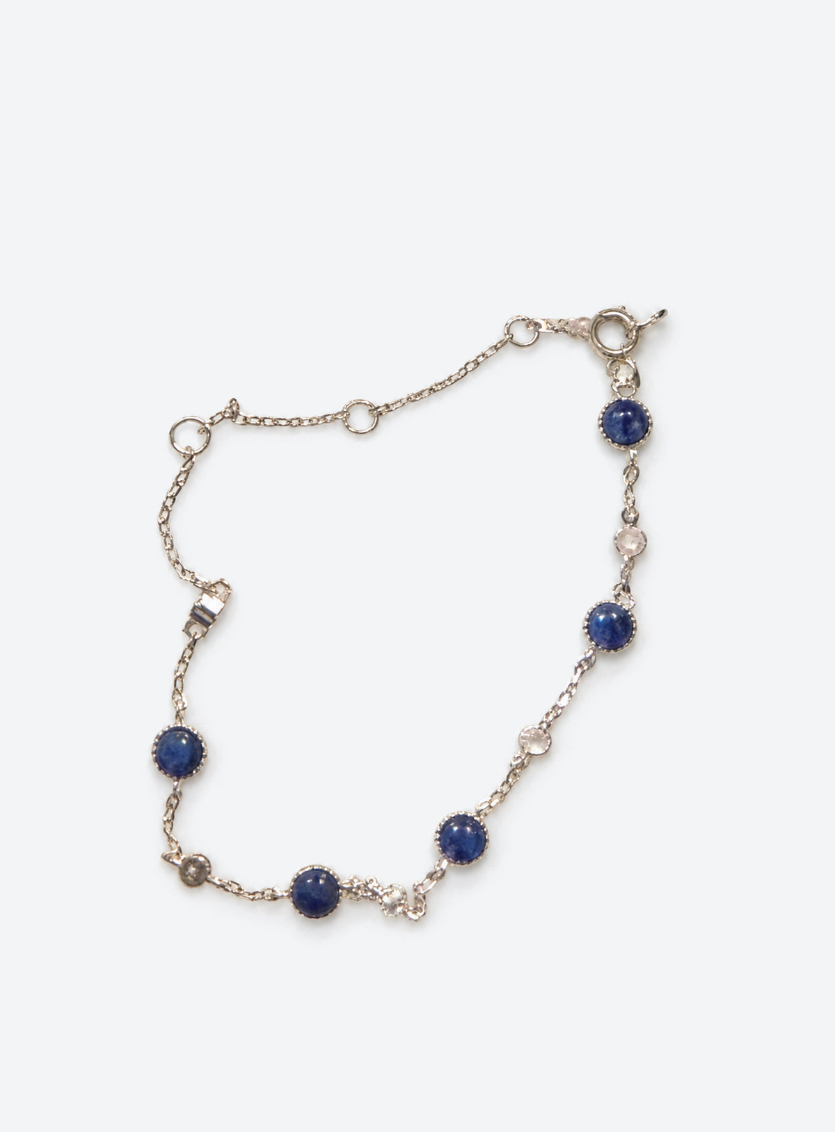 Blue and clear stone station bracelet with round settings and a delicate adjustable chain (Silver)