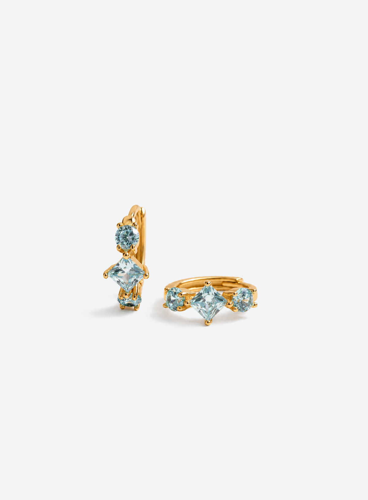 Small hoop earrings with pale blue round and diamond-shaped stones