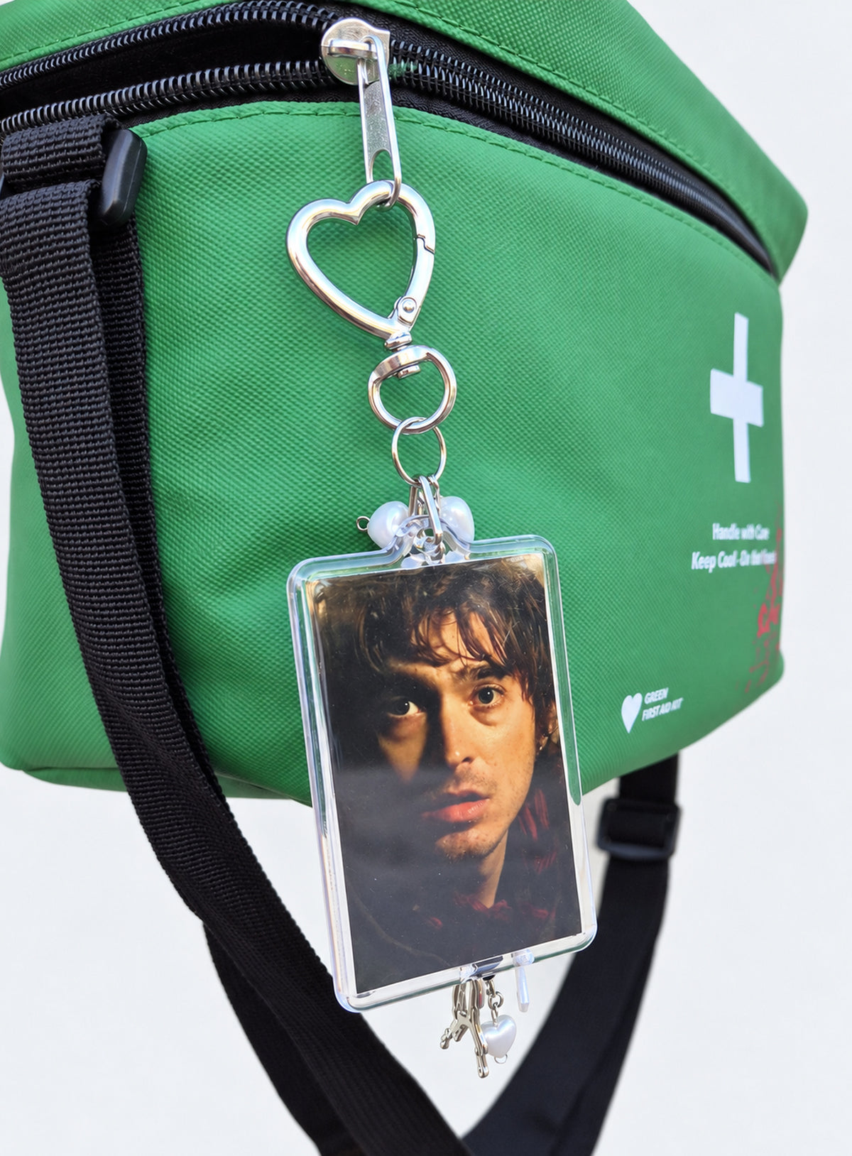 Bryan photo keychain with red and black beads and a heart-shaped clasp (Portrait)