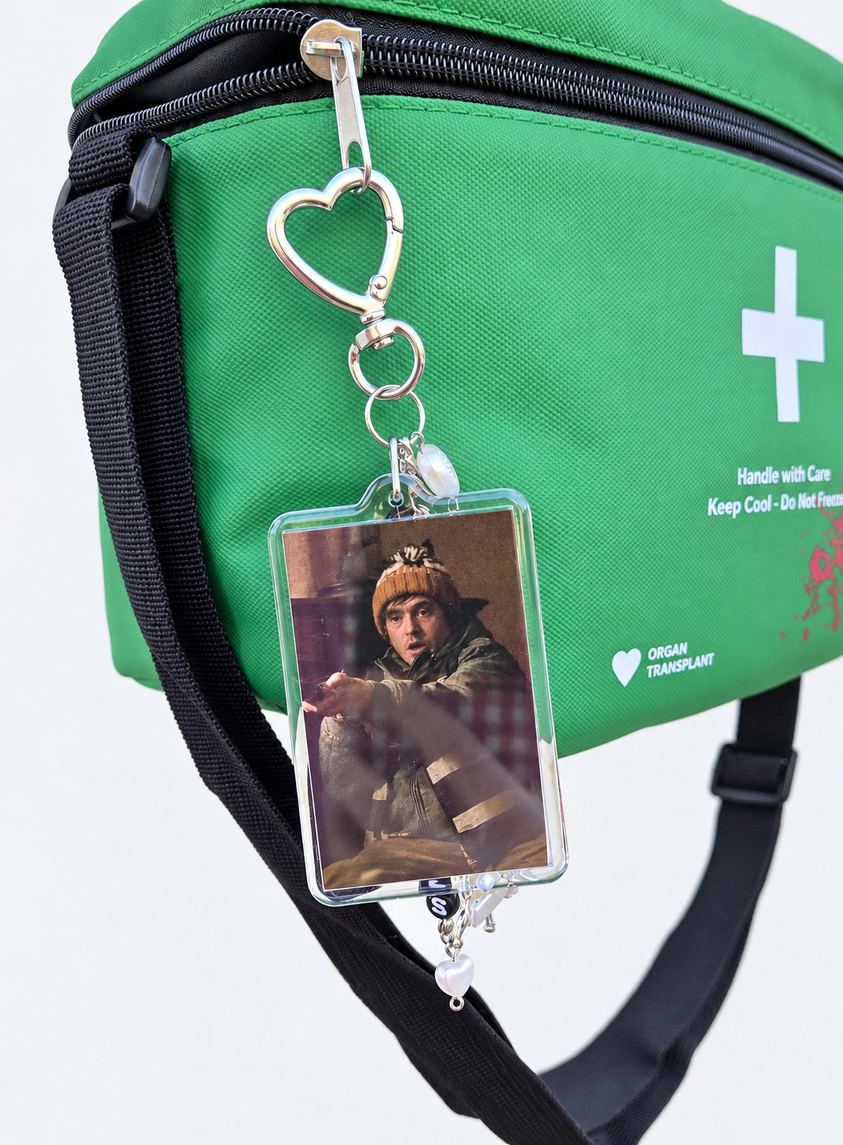 Bryan photo keychain with red and black beads and a heart-shaped clasp (Beanie)