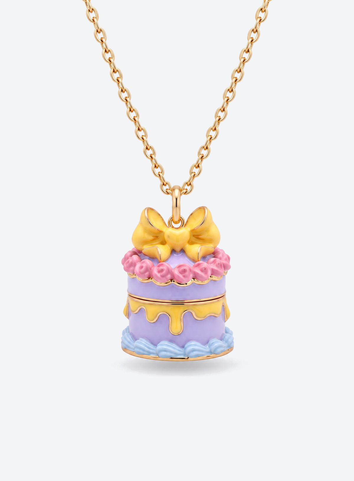 Cake-shaped necklace pendant with a bow, opening to reveal a small doll charm attached by a fine chain (Purple Cake)