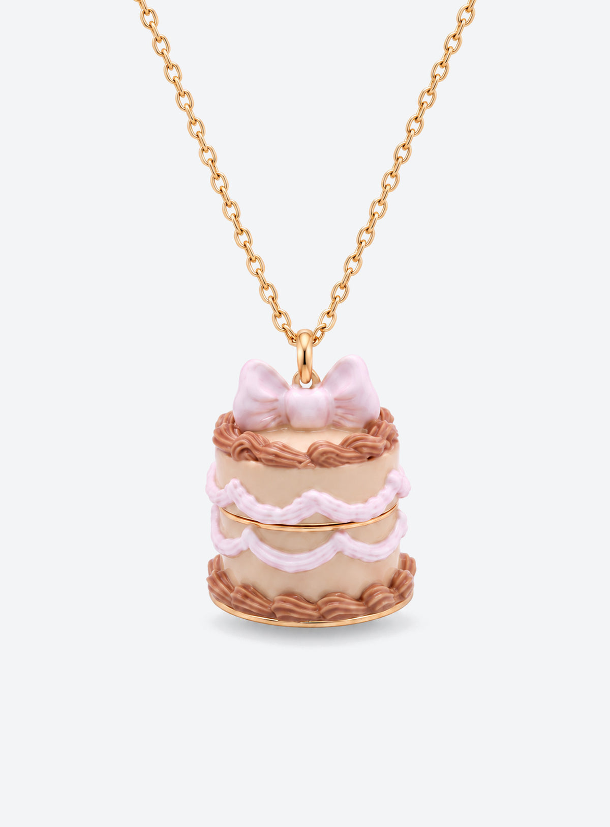 Cake-shaped necklace pendant with a bow, opening to reveal a small doll charm attached by a fine chain (Brown Cake)