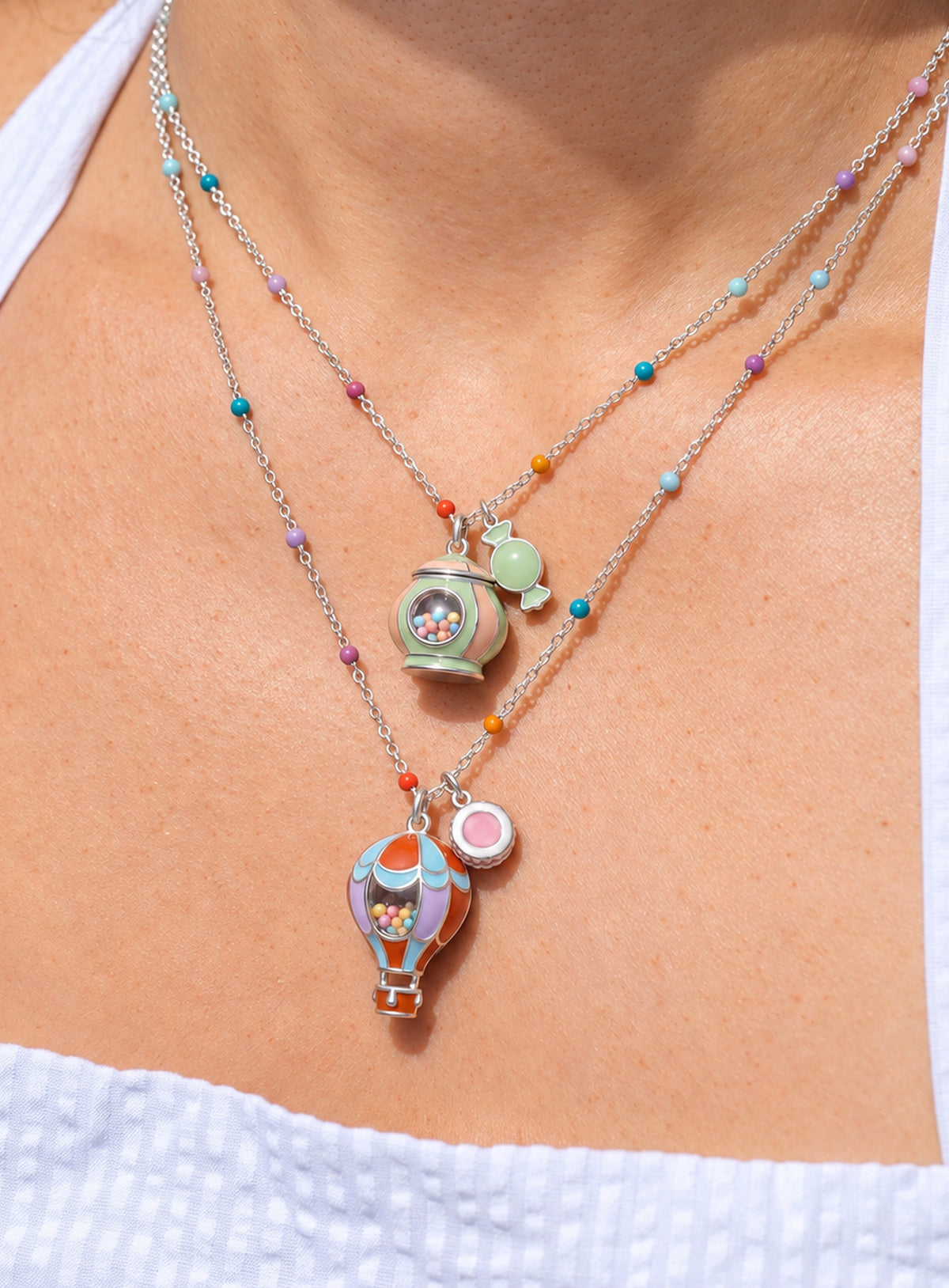 Candy-themed pendant necklace with a transparent window containing colorful candy-like beads
