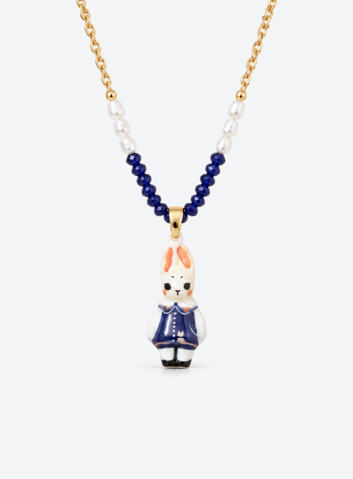 Hand-painted ceramic animal pendant necklace with gold-tone detailing and small colored beads on a delicate chain (Navy Rabbit)