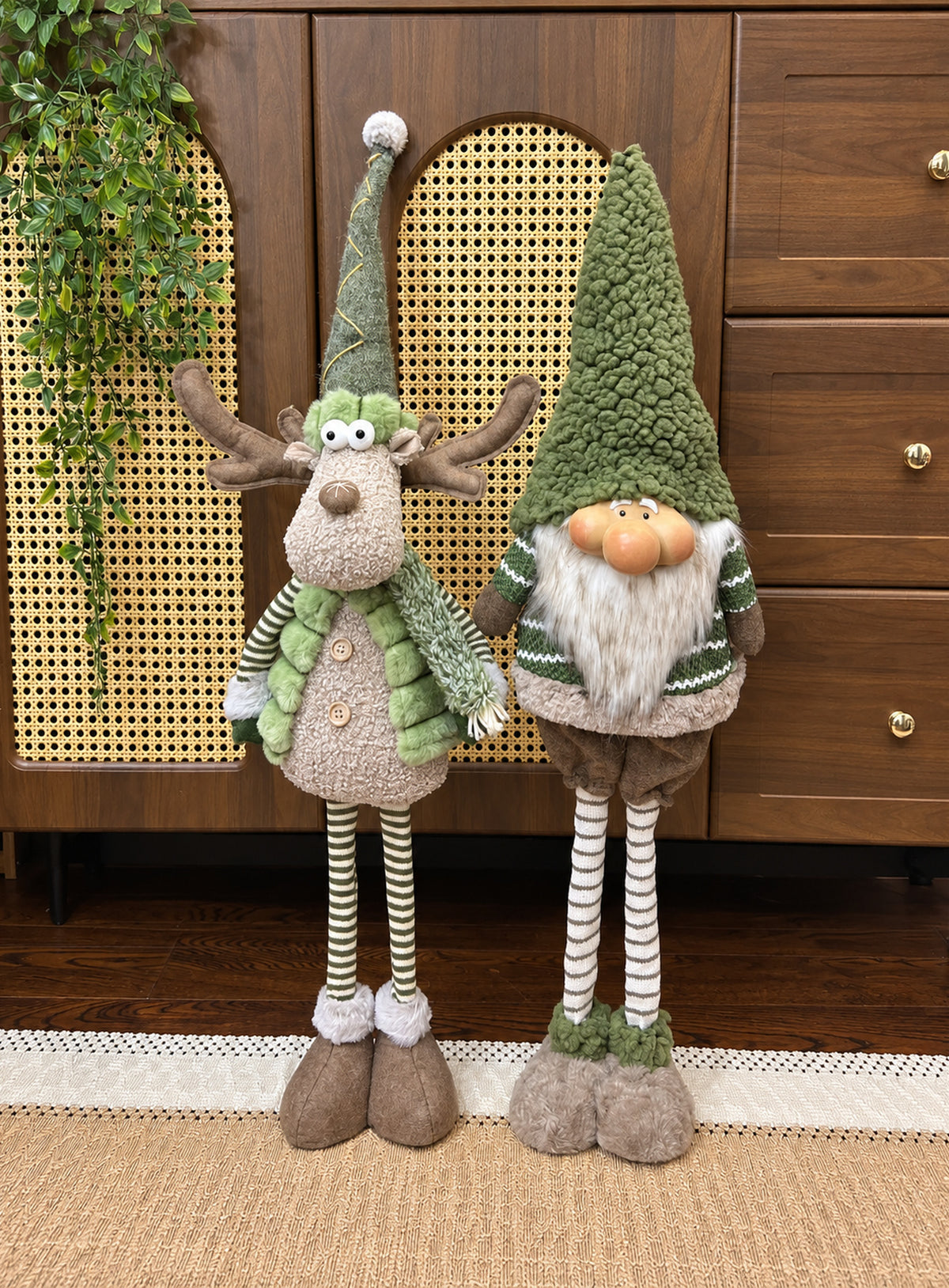 Green and brown fabric Christmas floor decoration with extendable striped legs, available in Reindeer or Gnome designs.