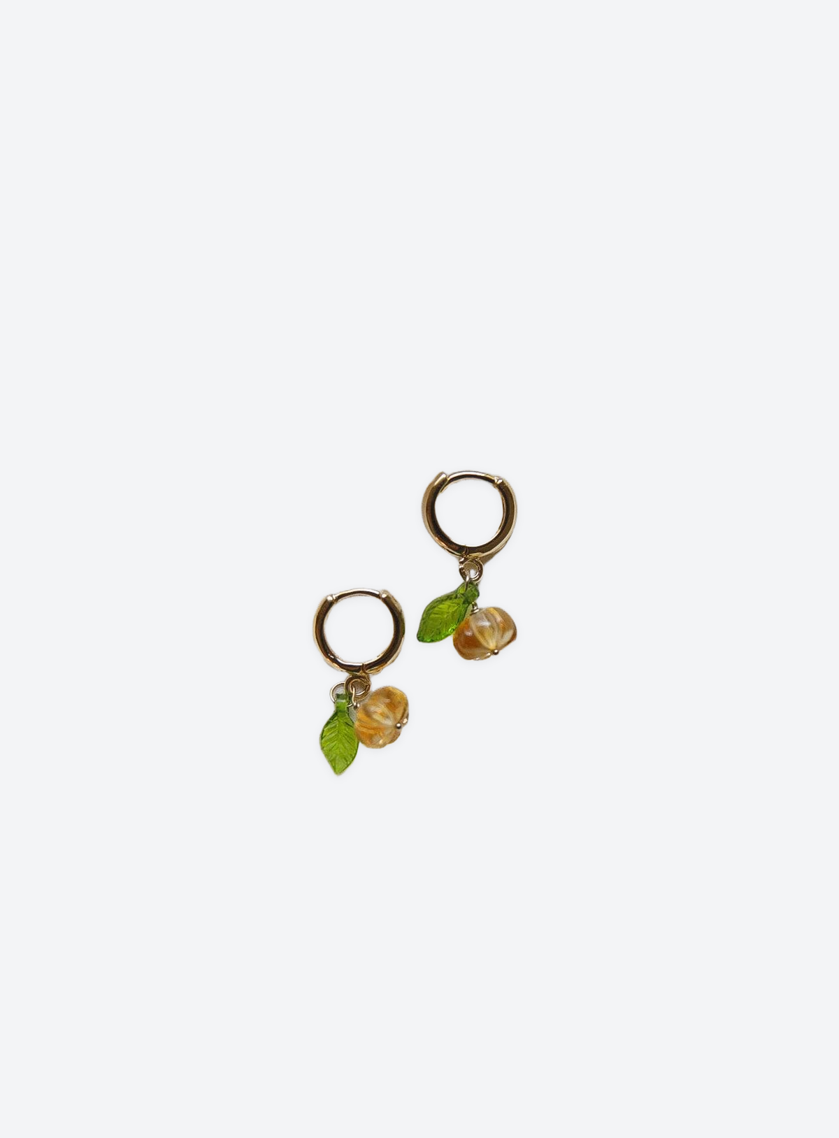 Pumpkin hoop earrings with citrine detail and gold-filled hoops on a clean studio background