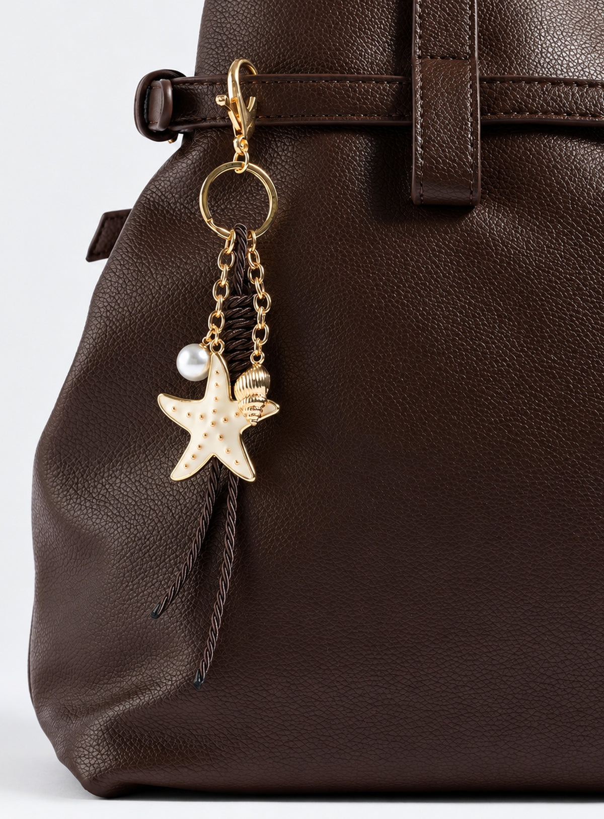 Coastal-style bag charm with its pictured clip or clasp and decorative accents.