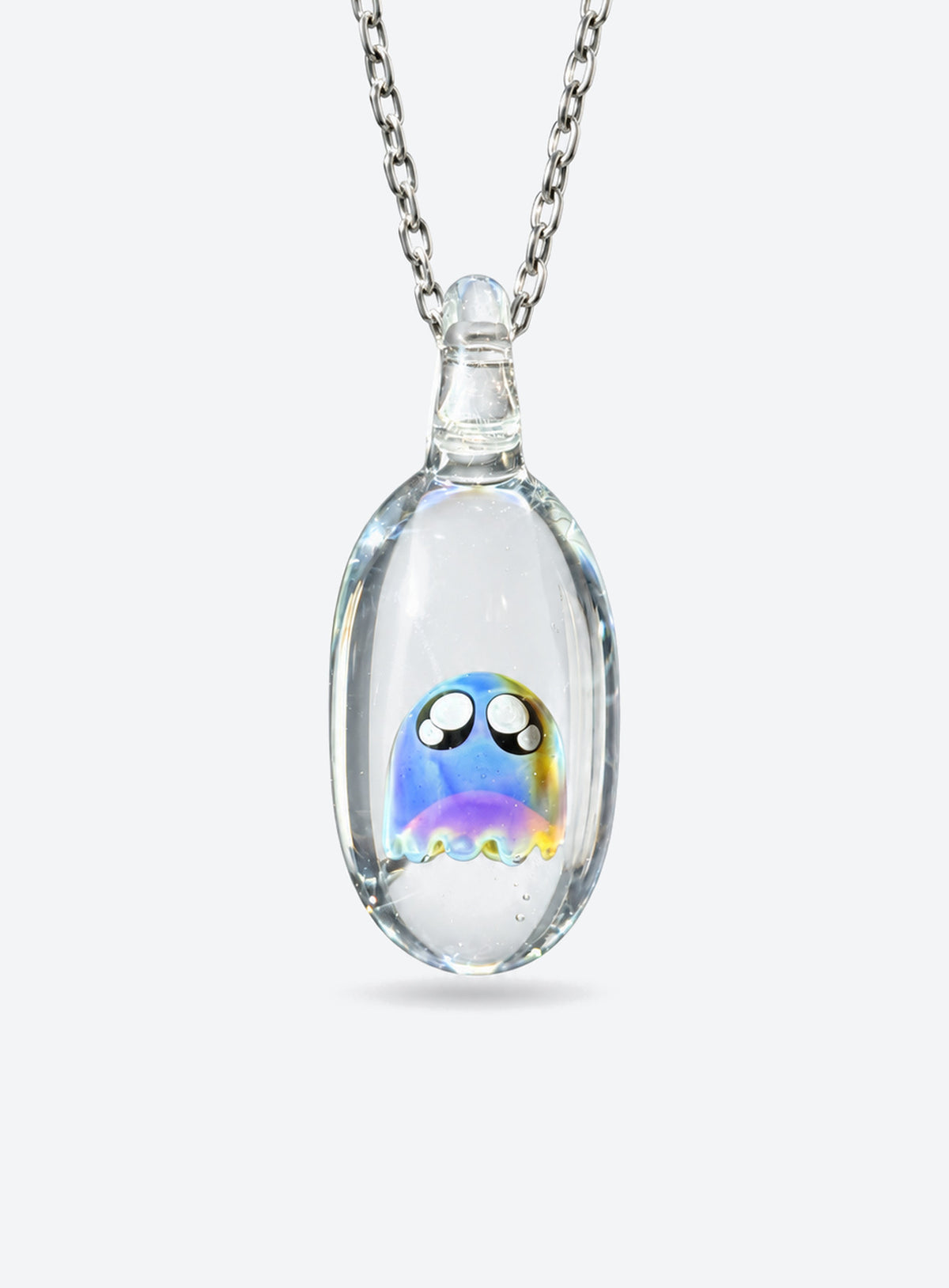 Rounded clear glass ghost pendant with large outlined eyes, small pale highlights, and a silver-tone chain