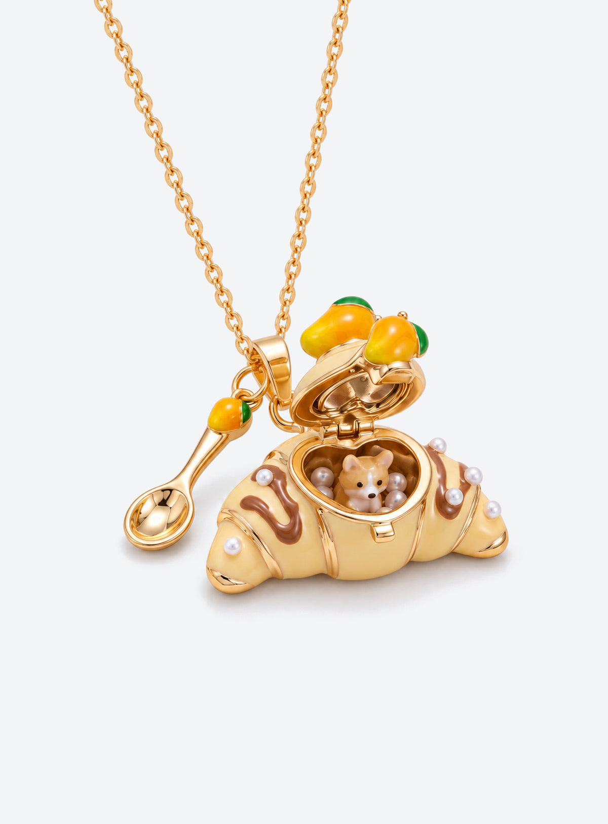Croissant-shaped enamel locket necklace with an animal figurine inside, a fine chain, and a small cutlery charm (Corgi)