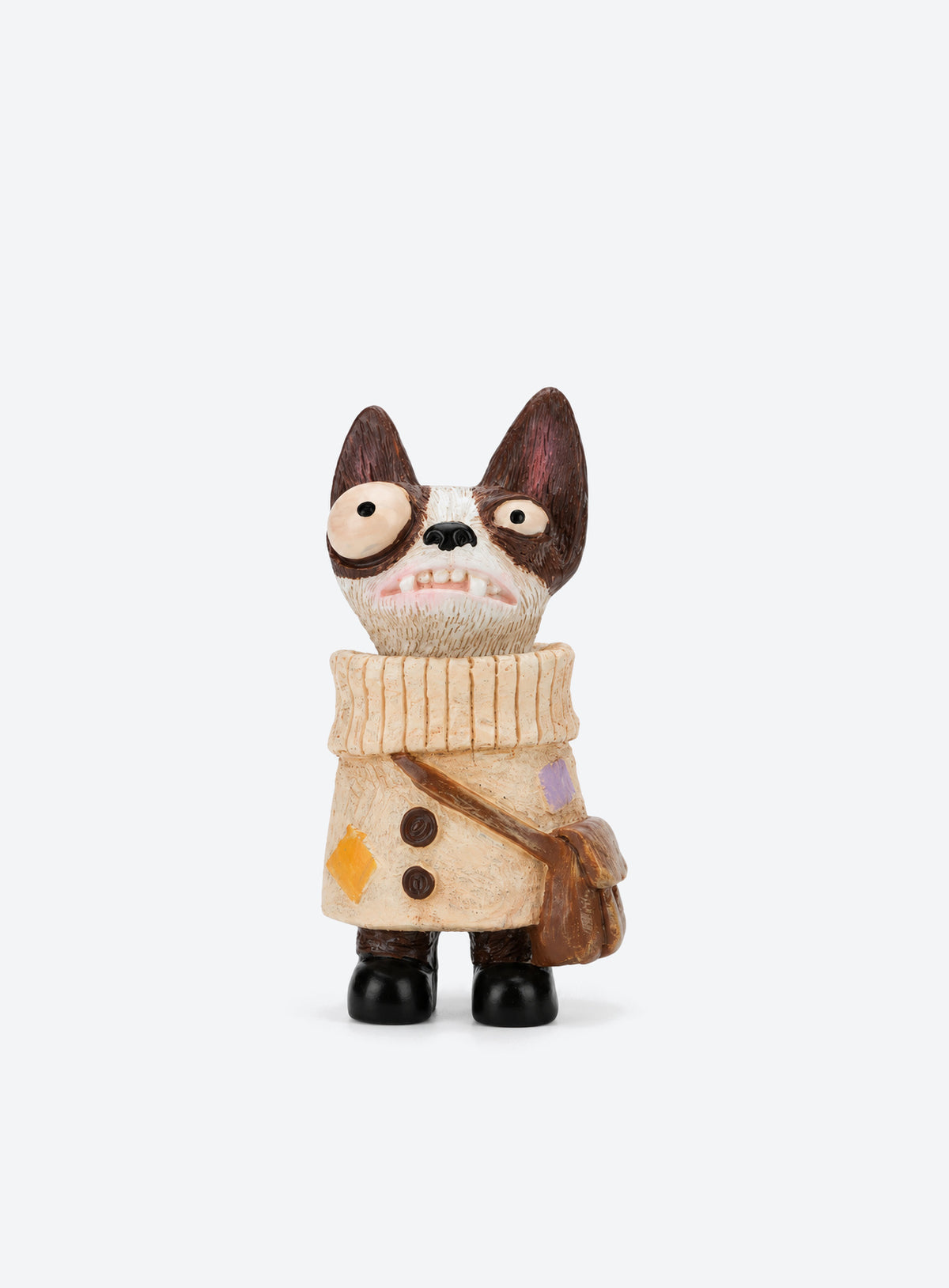 Hand-painted resin dog figurines with colorful outfits and distinctive details. (Scout)