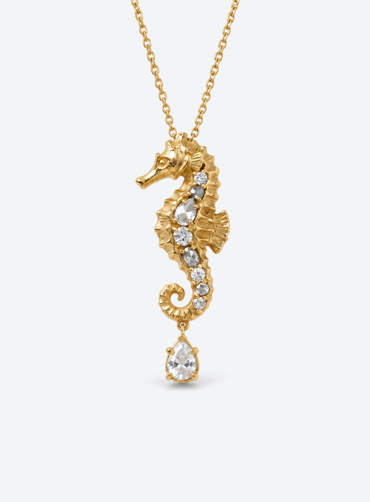 Ocean pendant necklace with a textured gold-tone surface, clear crystal accents and a hanging teardrop crystal (Seahorse)