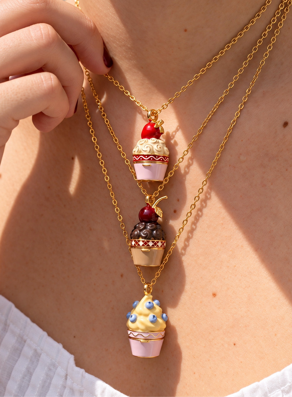 Cupcake-shaped locket necklace with colorful enamel and gold-tone trim
