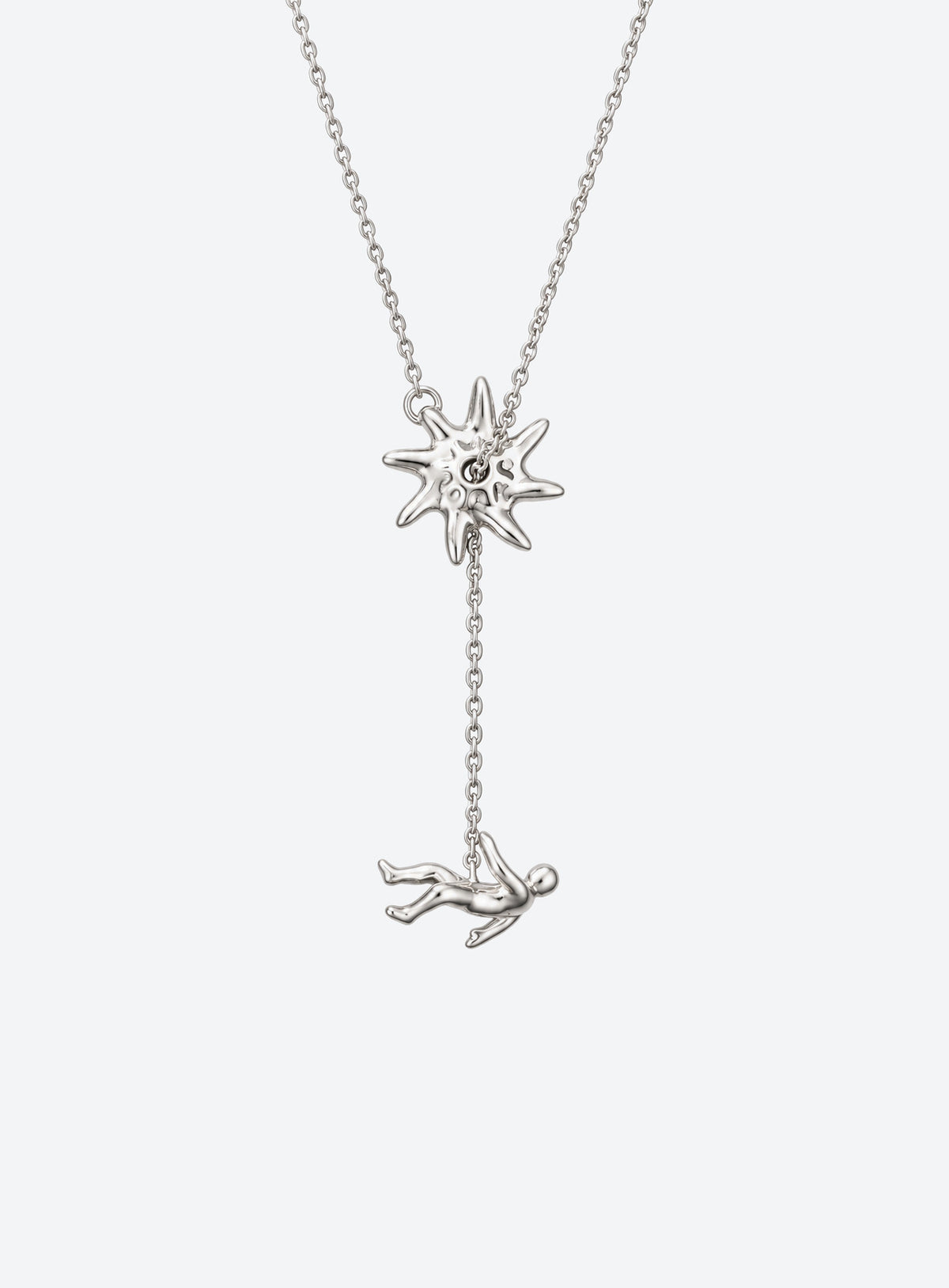Y-shaped necklace with a hammered sunburst above a small falling figure