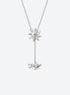 Y-shaped necklace with a hammered sunburst above a small falling figure