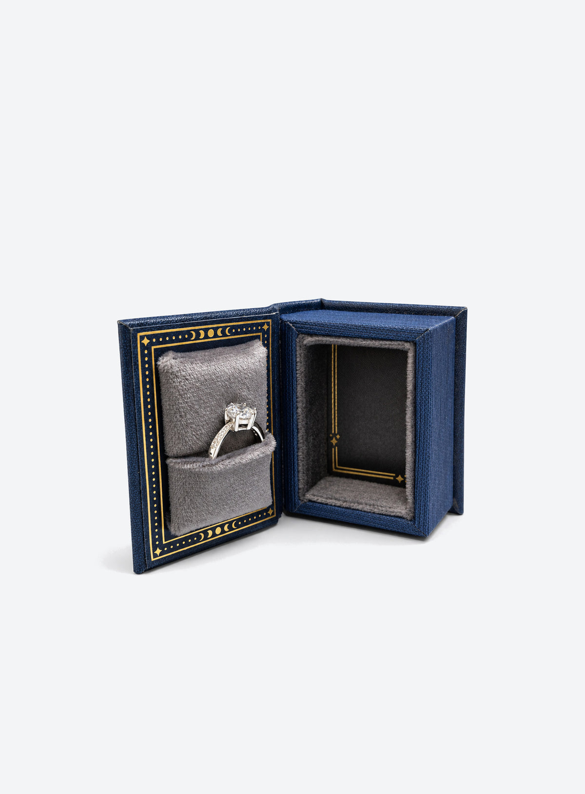 Book-shaped celestial ring box with sun, moon and star details