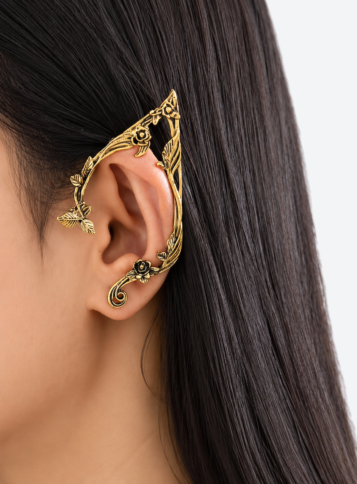 Gold-color mirrored pair of elf-inspired ear cuffs with flower, leaf, and vine details.