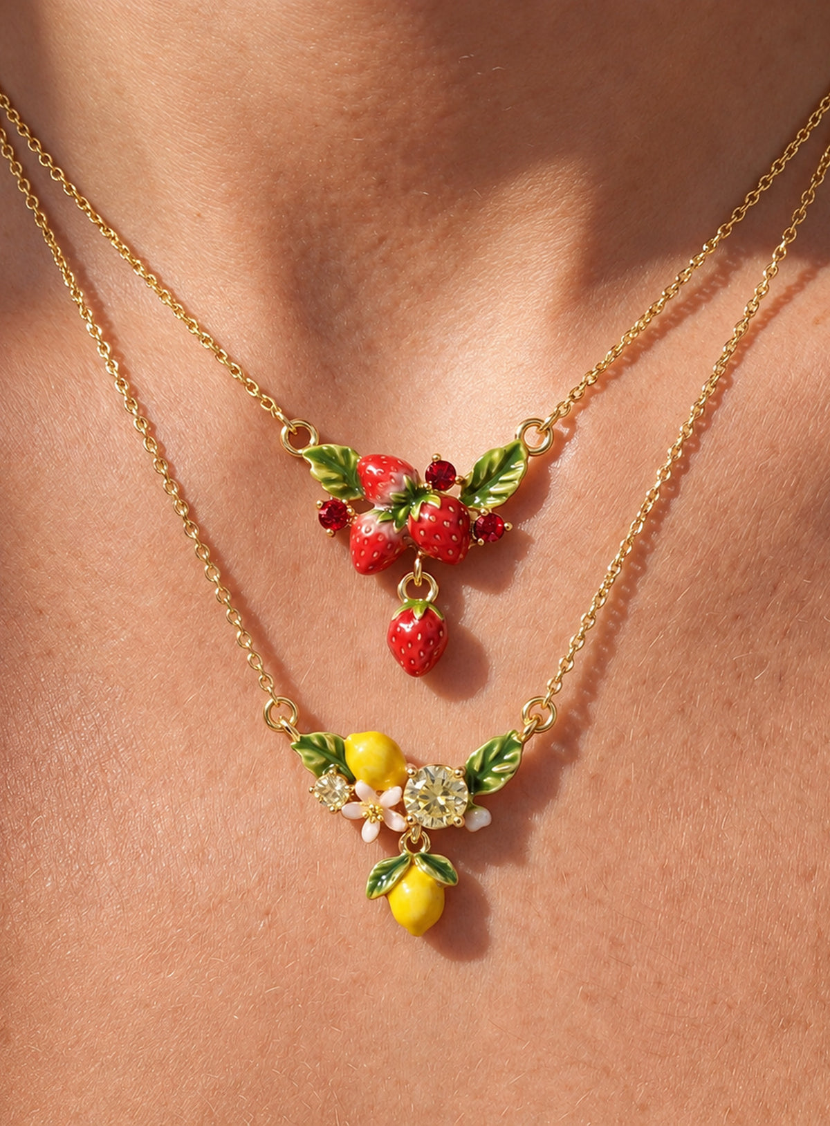 Colorful enamel fruit pendant necklace with crystal accents and leaf details