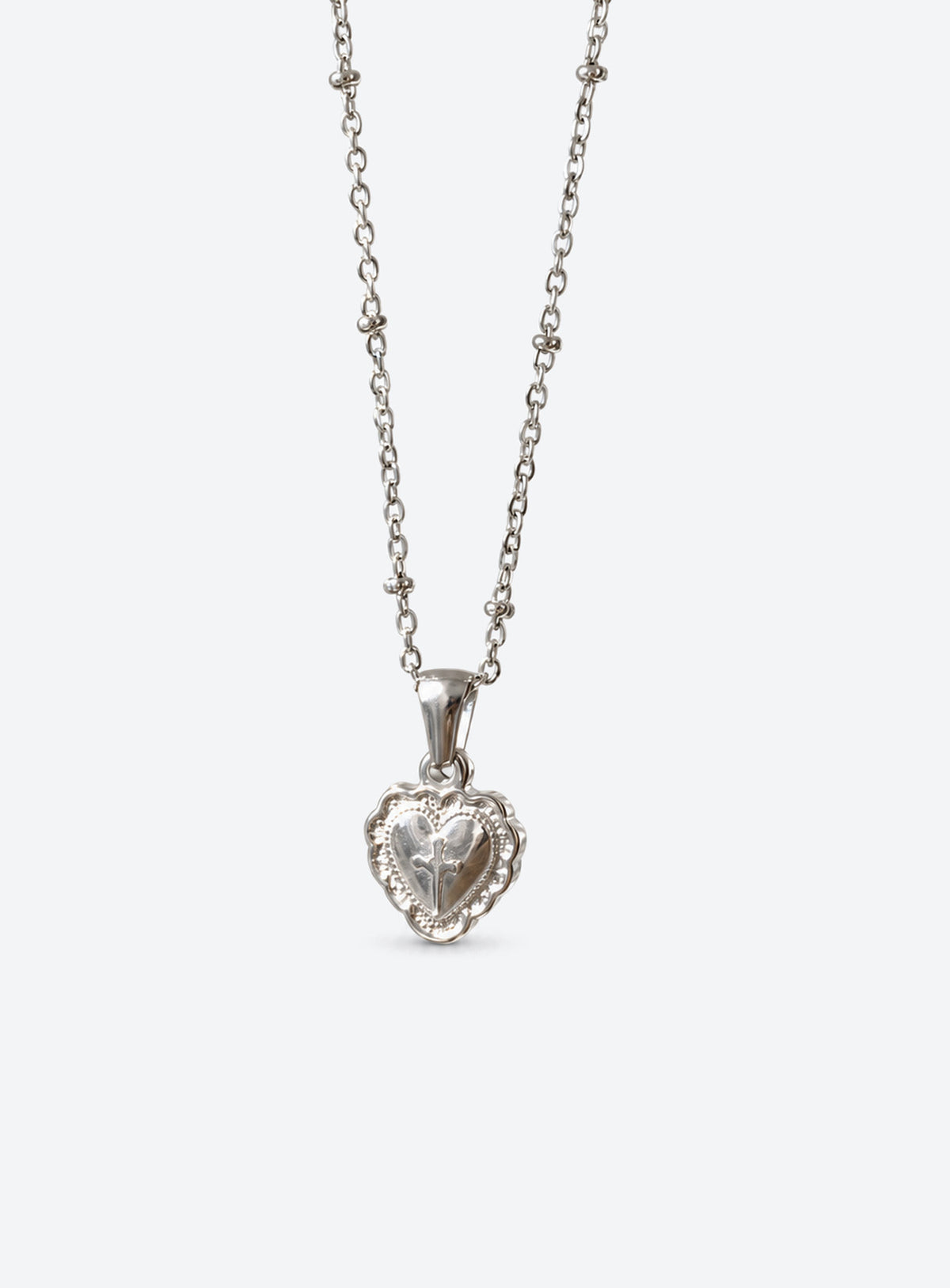 Silver-tone fine chain necklace with engraved heart pendant and raised reflective metal centre