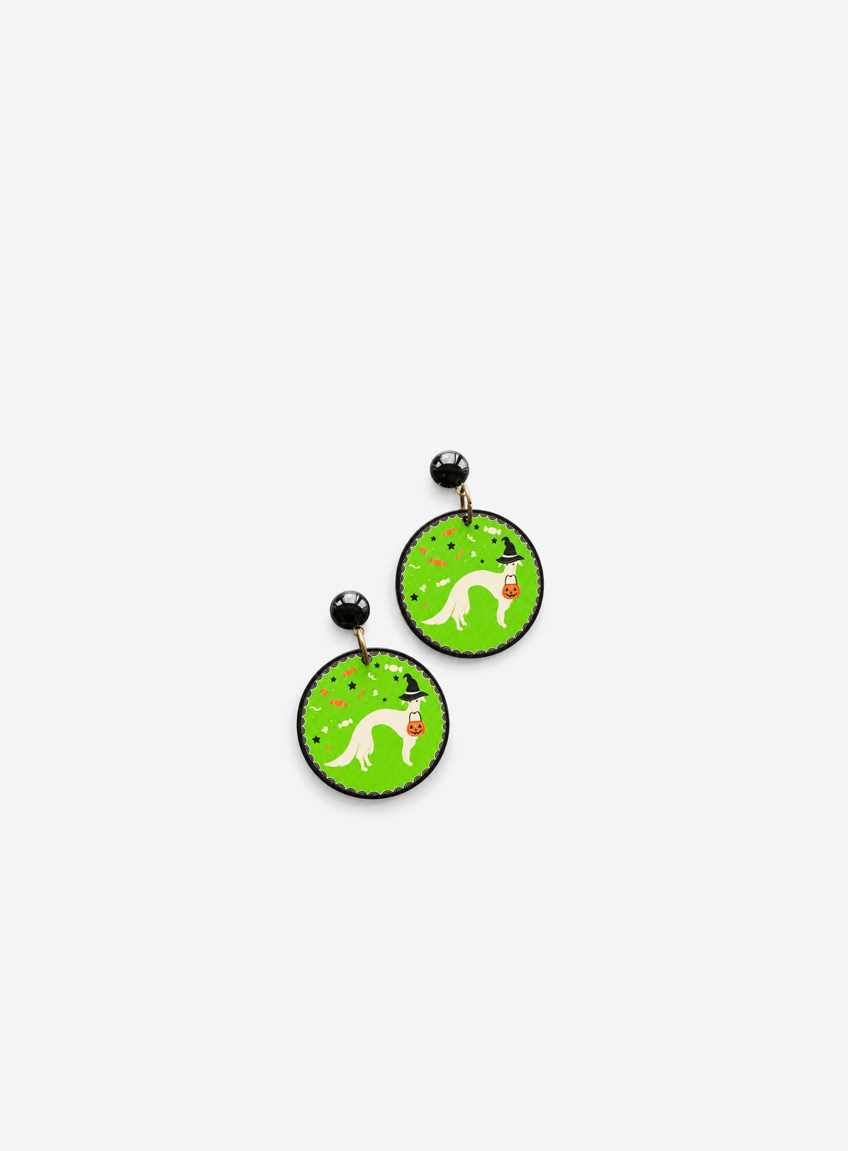Acrylic Halloween dog charm earrings shown in a studio product photo