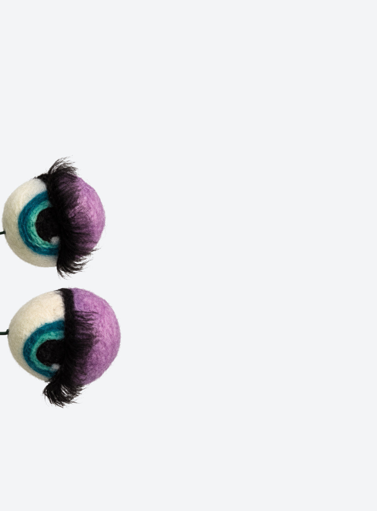 Felt eyeball plant stakes with colorful eyeshadow, eyelashes, and floral wire stems