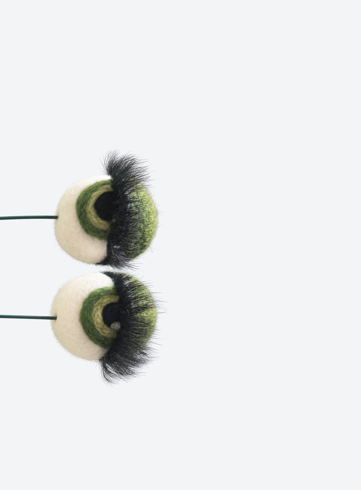 Felt eyeball plant stakes with colorful eyeshadow, eyelashes, and floral wire stems