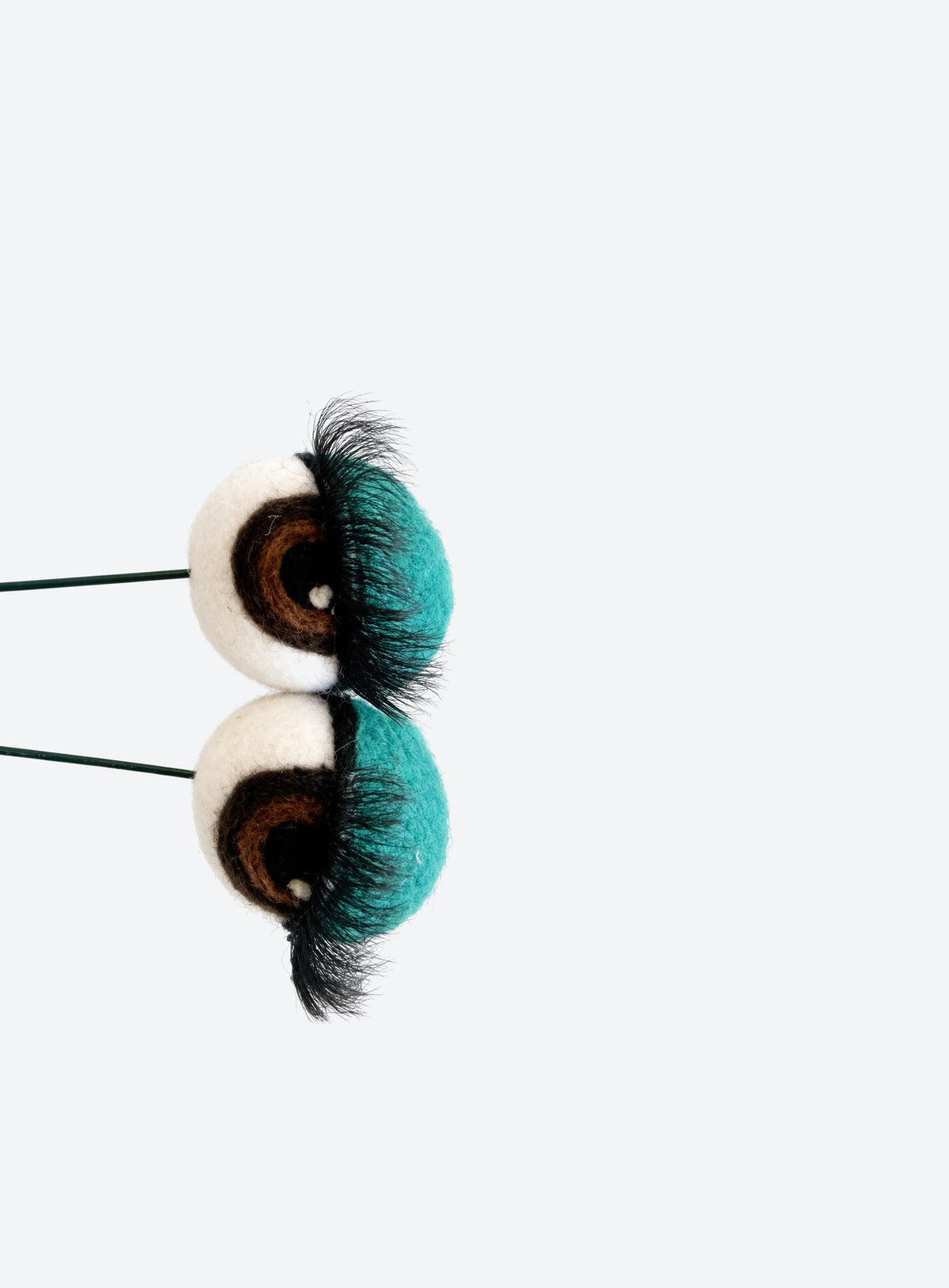 Felt eyeball plant stakes with colorful eyeshadow, eyelashes, and floral wire stems