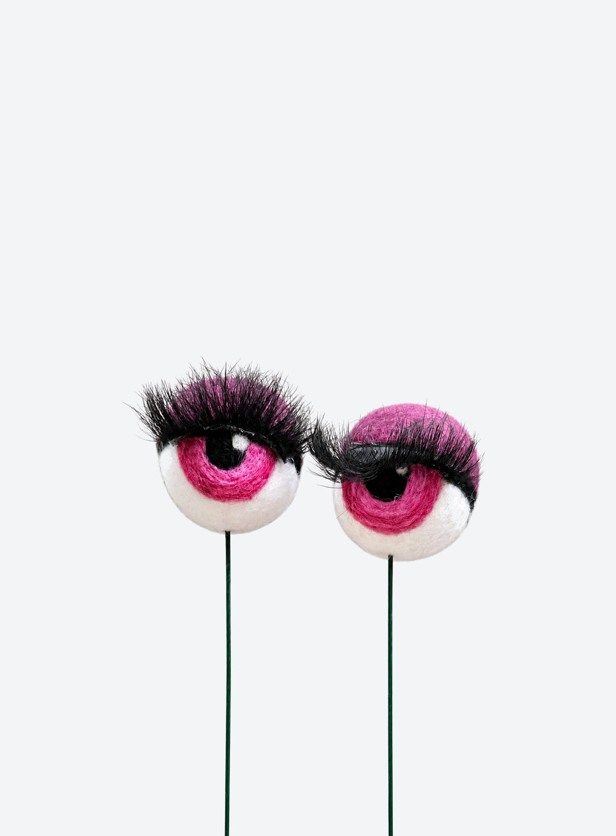 Felt eyeball plant stakes with colorful eyeshadow, eyelashes, and floral wire stems