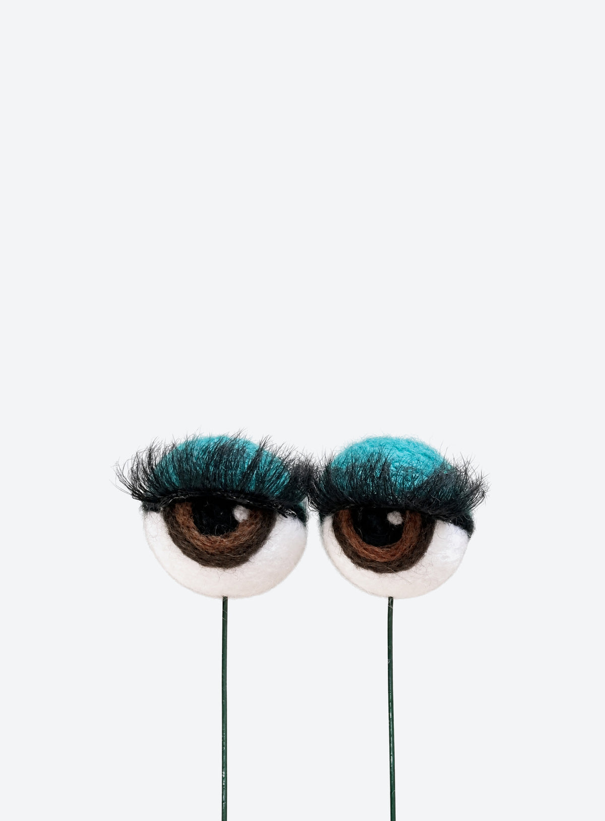 Felt eyeball plant stakes with colorful eyeshadow, eyelashes, and floral wire stems