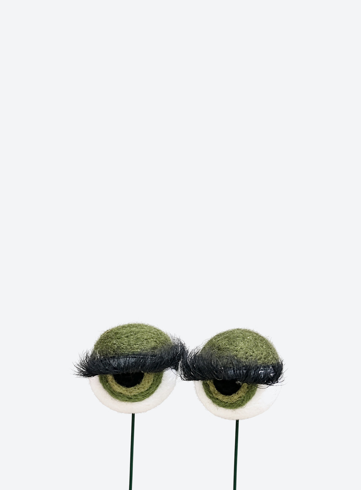 Felt eyeball plant stakes with colorful eyeshadow, eyelashes, and floral wire stems